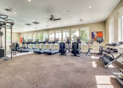 Thumbnail 32 of 36 - 24-Hour Fitness Center Equipped With Treadmills, Elliptical Machines, Weight Training Equipment, Ceiling Fan, Mirror Wall, And Plenty Of Windows at Montrachet Apartments, Napa, 94558