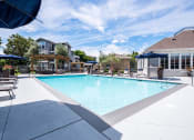 Thumbnail 36 of 36 - Outdoor pool area with lounge chairs at Montrachet Apartments, Napa