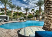 Thumbnail 38 of 67 - Pool with lounge area and cabana seating