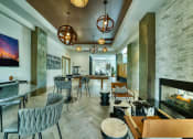 Thumbnail 56 of 67 - Clubroom with fireplace and lounge seating