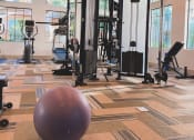 Thumbnail 50 of 67 - Fitness center with workout equipment