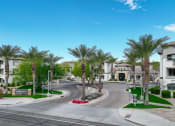 Thumbnail 20 of 67 - an empty street with palm trees in front of apartment buildings