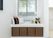 Thumbnail 53 of 67 - a window seat with a few pillows and a plant