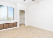 Thumbnail 30 of 67 - an empty room with a large window and a closet