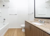 Thumbnail 58 of 67 - a bathroom with a sink and a toilet and a shower