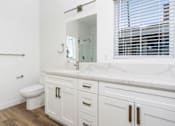 Thumbnail 5 of 44 - A white bathroom with a toilet, sink, and mirror. at Nola 624, California, 91790