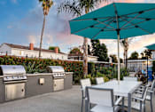 Thumbnail 38 of 44 - A patio with a table, chairs and a grill. at Nola 624, California