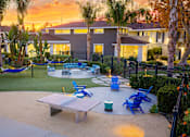 Thumbnail 41 of 44 - A backyard with a hammock, table, and chairs. at Nola 624, West Covina, CA