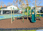 Thumbnail 40 of 44 - A playground with a green slide and a red swing set. at Nola 624, West Covina, CA 91790