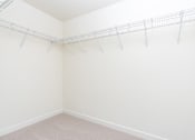 Thumbnail 29 of 52 - A white wall with a metal rack on it.
