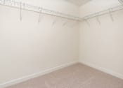 Thumbnail 40 of 52 - Empty room with white walls and a metal rack on the wall.