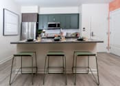 Thumbnail 18 of 93 - A Kitchen With Bar Stool at North Grove, California, 92501