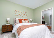 Thumbnail 23 of 93 - A Bedroom With a Bed And Lamp at North Grove, Riverside, CA, 92501