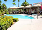 Thumbnail 26 of 39 - A pool area with a canopy and chairs at Avalon at Seven Hills Apartments, Henderson, 91790