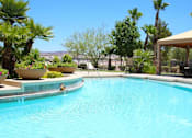 Thumbnail 20 of 39 - A pool surrounded by palm trees and a gazebo at Avalon at Seven Hills Apartments, Henderson