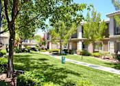 Thumbnail 37 of 39 - A row of houses with green grass in front at Avalon at Seven Hills Apartments, Henderson, Nevada