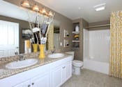 Thumbnail 29 of 123 - a bathroom with white cabinets and a yellow shower curtain