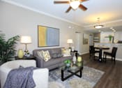 Thumbnail 33 of 123 - a living room with a couch and a table