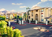 Thumbnail 97 of 123 - an outdoor basketball court with apartments in the background