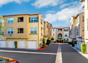 Thumbnail 73 of 123 - a row of apartments with white doors and a red carpet
