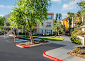 Thumbnail 74 of 123 - an empty parking lot in front of an apartment building