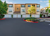 Thumbnail 75 of 123 - an empty parking lot in front of an apartment building