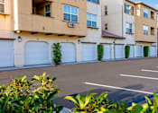 Thumbnail 105 of 123 - an empty parking lot in front of an apartment building
