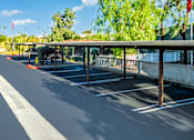 Thumbnail 76 of 123 - an empty parking lot with a covered parking lot