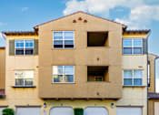 Thumbnail 79 of 123 - a street view of a building with garage doors