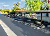 Thumbnail 109 of 123 - an empty parking lot with a covered parking lot