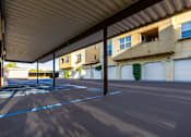 Thumbnail 80 of 123 - an empty parking lot in front of a building with white garage doors