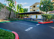 Thumbnail 82 of 123 - an empty parking lot with a building in the background
