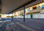 Thumbnail 113 of 123 - an empty parking lot in front of a building with white garage doors