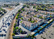 Thumbnail 84 of 123 - an aerial view of a city with cars on the street and buildings