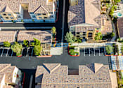 Thumbnail 120 of 123 - an aerial view of a neighborhood with houses and a parking lot
