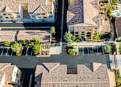 Thumbnail 90 of 123 - an aerial view of a neighborhood with houses and a parking lot