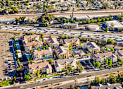 Thumbnail 119 of 123 - an aerial view of an urban area with cars on a freeway