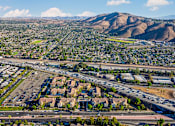 Thumbnail 123 of 123 - an aerial view of the city with highways and mountains