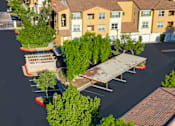 Thumbnail 95 of 123 - an aerial view of a parking lot with benches and trees
