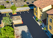 Thumbnail 96 of 123 - an aerial view of an empty parking lot in a residential neighborhood