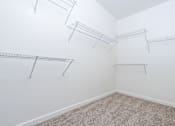 Thumbnail 22 of 123 - a walk in closet with shelves