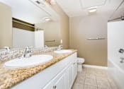 Thumbnail 23 of 123 - a bathroom with a toilet sink and shower