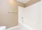Thumbnail 24 of 123 - a bathroom with a tub and a toilet