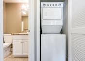 Thumbnail 27 of 123 - a laundry room with a washer and dryer