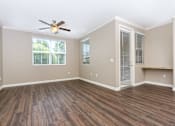 Thumbnail 14 of 123 - a bedroom with hardwood floors and a ceiling fan