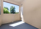 Thumbnail 26 of 123 - a patio with a large window and a door