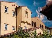 Thumbnail 58 of 123 - a large building with a blue sky in the background