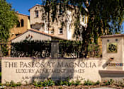 Thumbnail 1 of 123 - Entrance sign of Paseos at Magnolia Apartment Homes