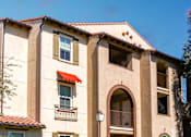 Thumbnail 62 of 123 - a building with a red roof and a blue sky