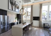 Thumbnail 41 of 62 - resident kitchen with fridge and lounge seating at Capriana at Chino Hills, Chino Hills, 91709